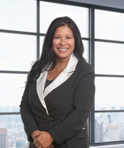 Barbara Beavers' headshot. Barbara is pictured smiling and wearing a black dress with a white collar.